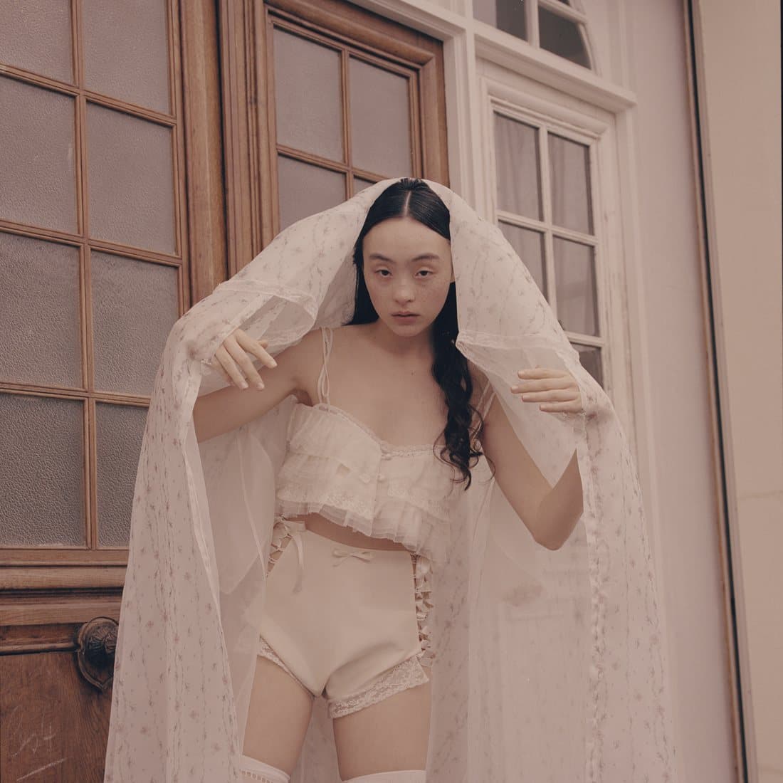 A veil worn over a corset
