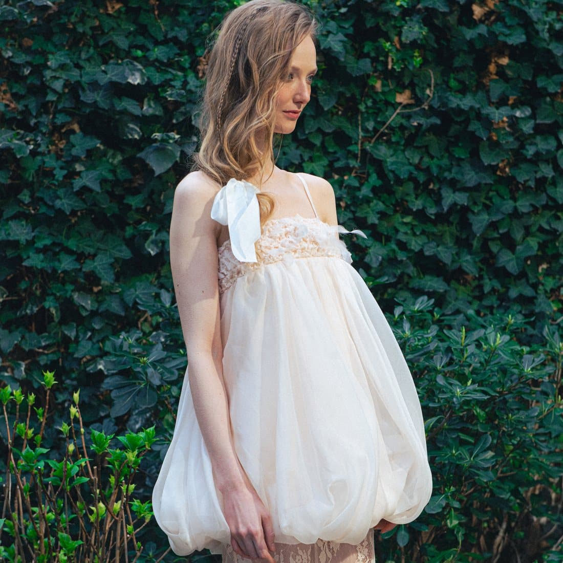 A balloon dress against ivy