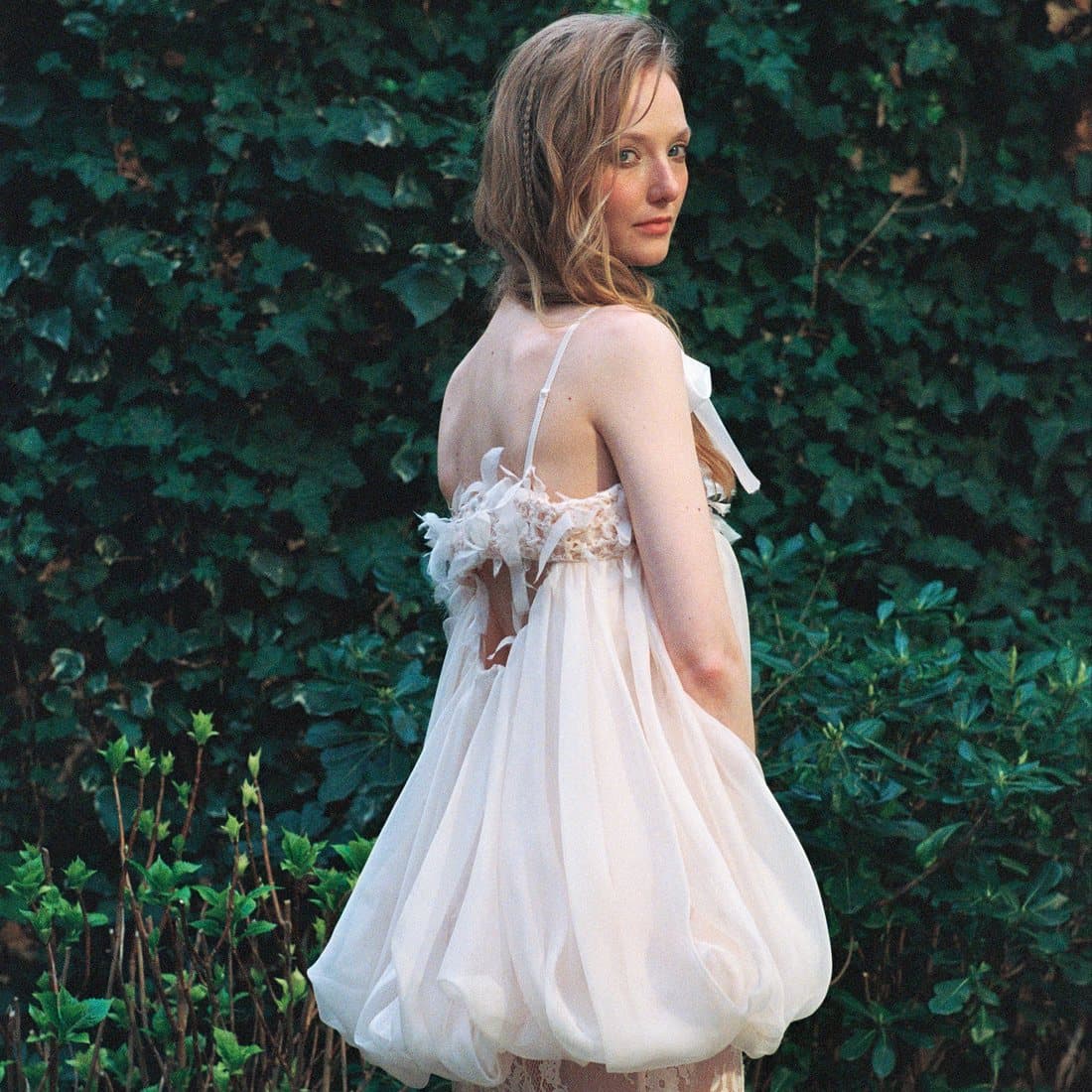 A full-length look against ivy