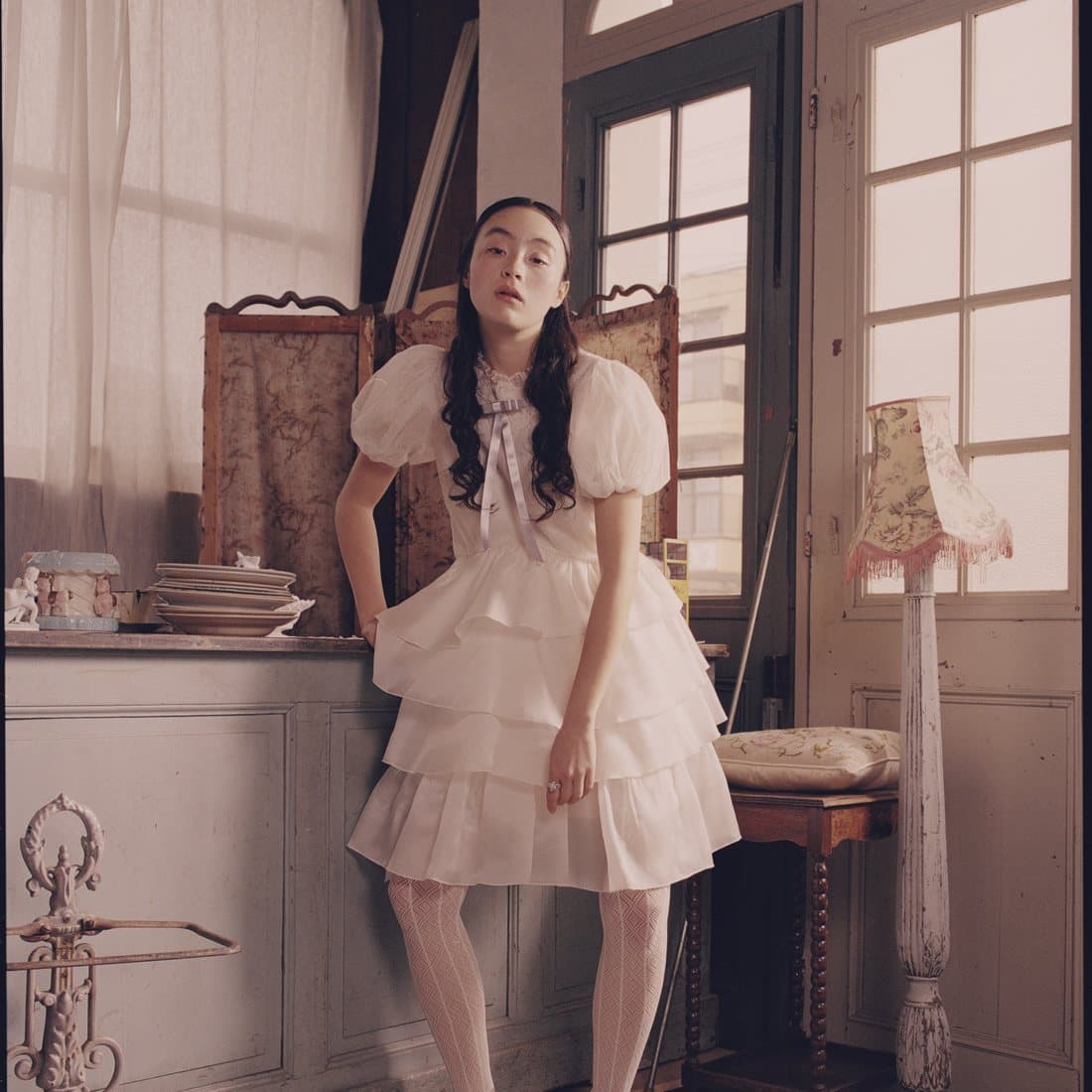 A pleated dress by the window